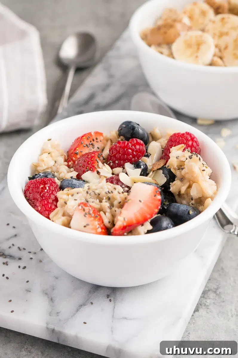 oatmeal served with berries almonds and maple syrup