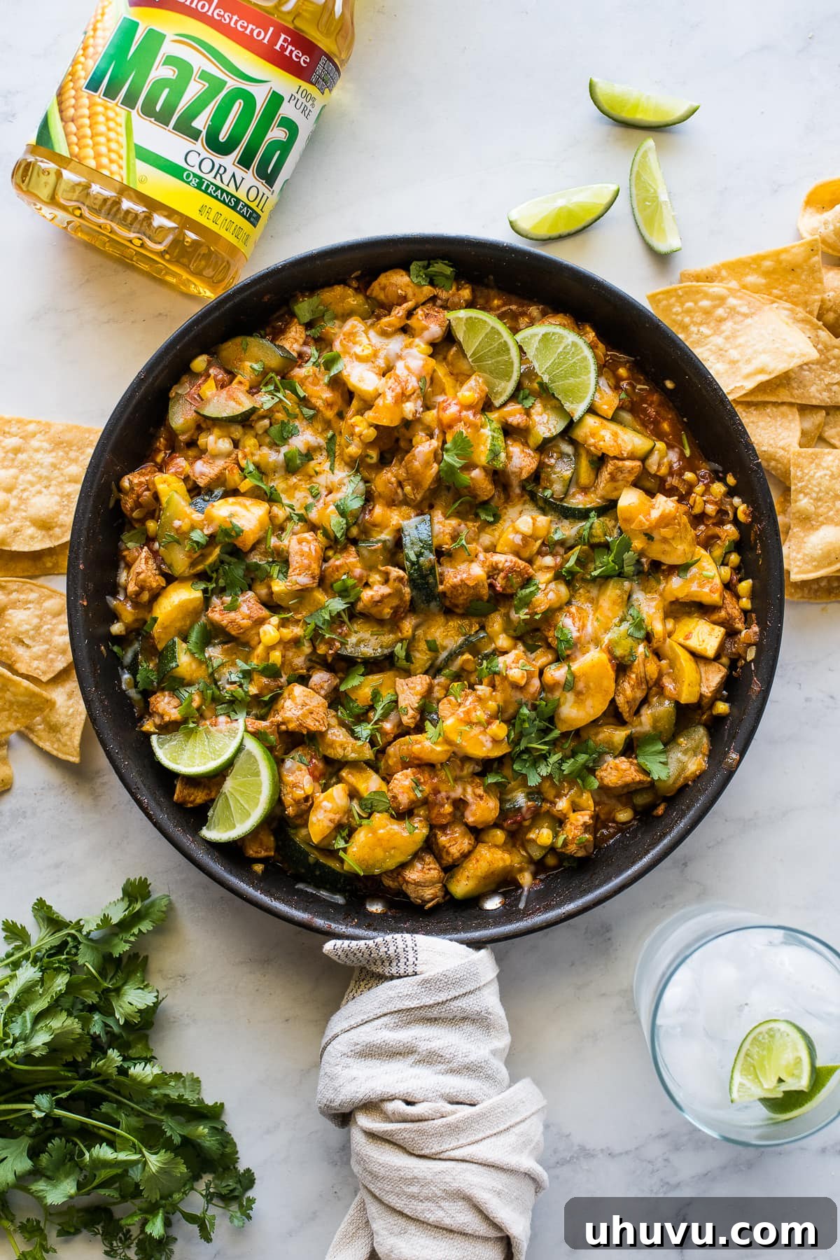 Mexican Chicken and Squash skillet garnished with cilantro and lime juice.