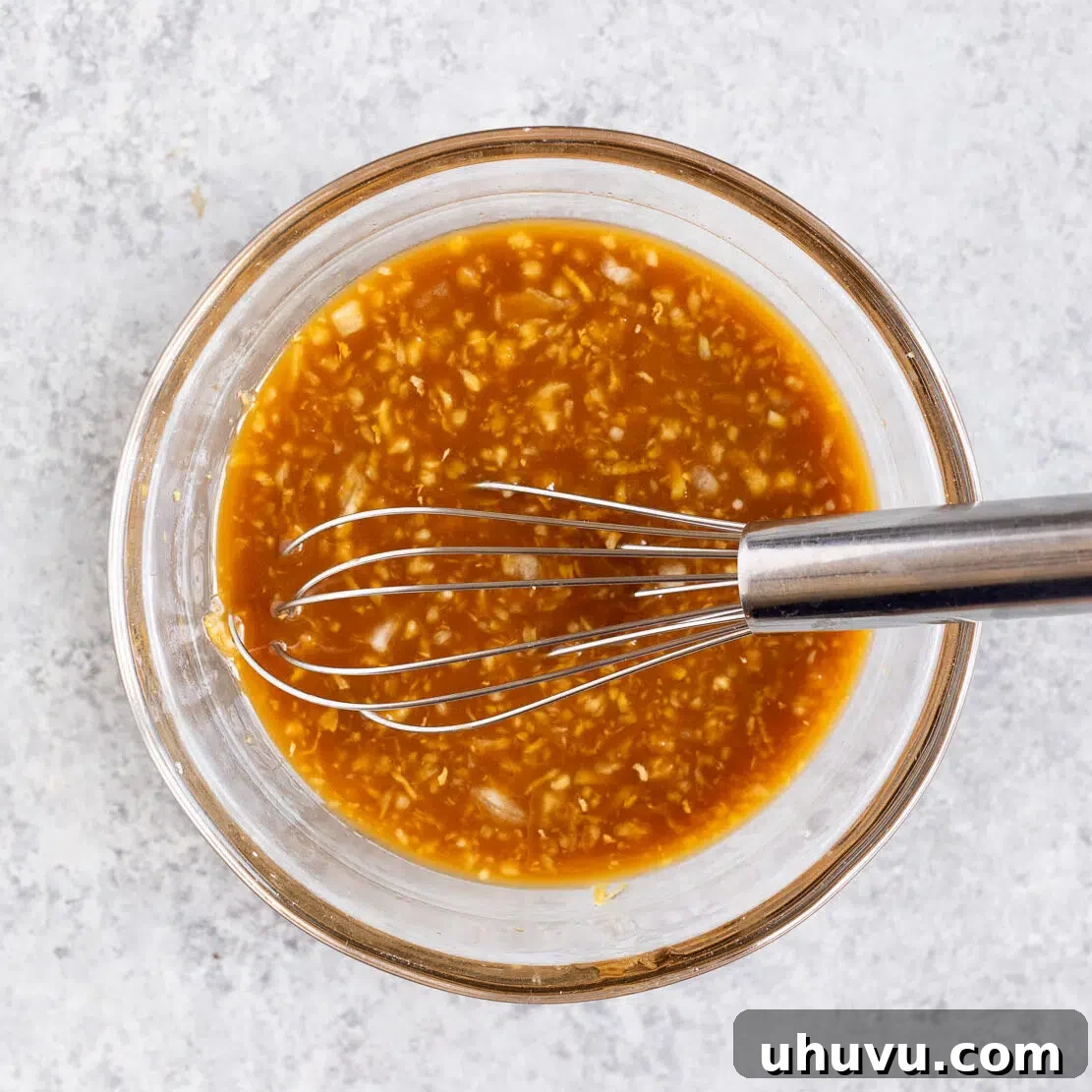 A bowl of savory sweet stir fry sauce, whisked and ready