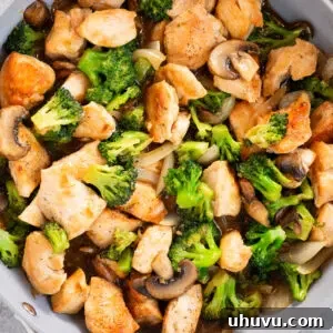 chicken and broccoli stir fry in a skillet