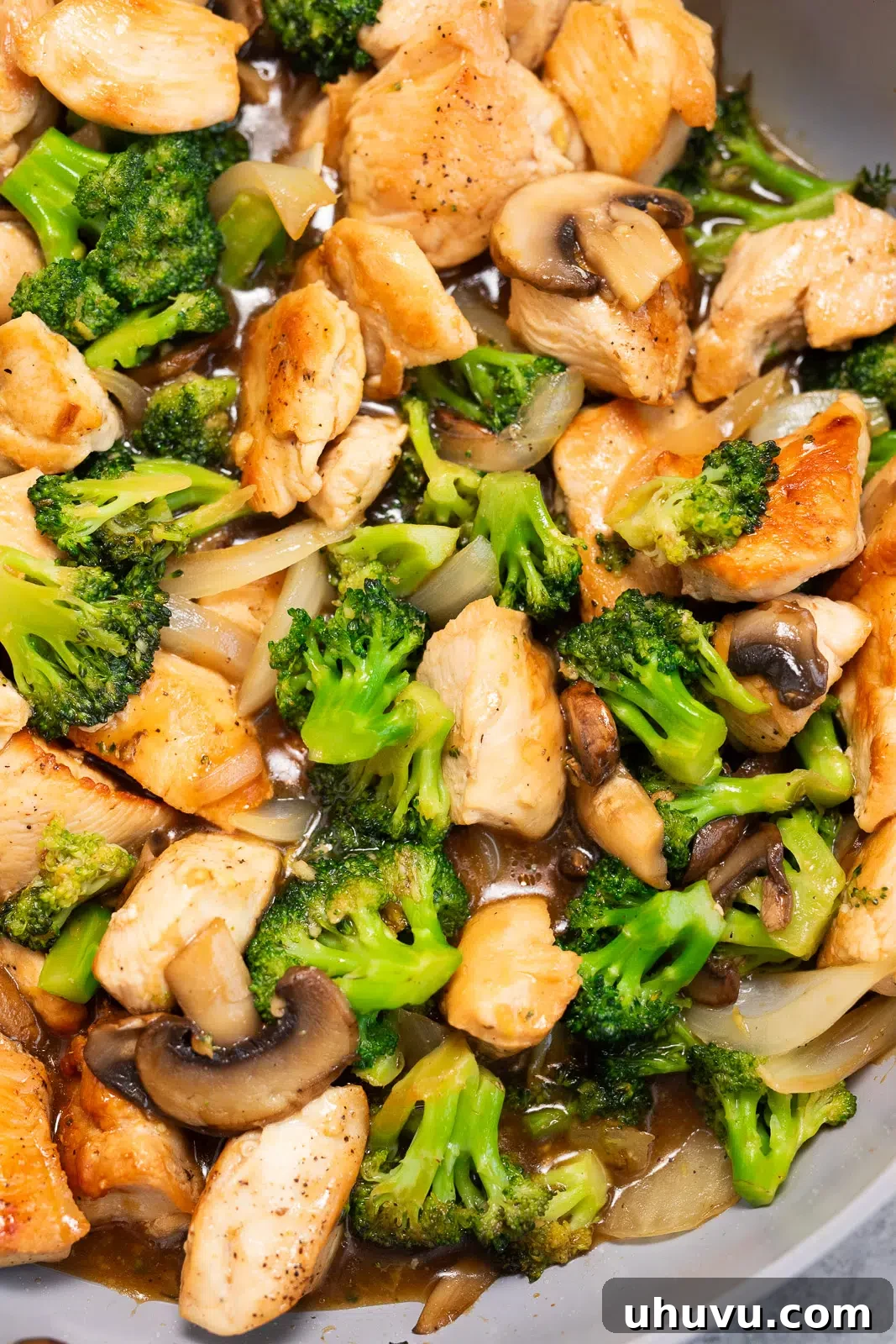 chicken, broccoli mushrooms cooked in a skillet
