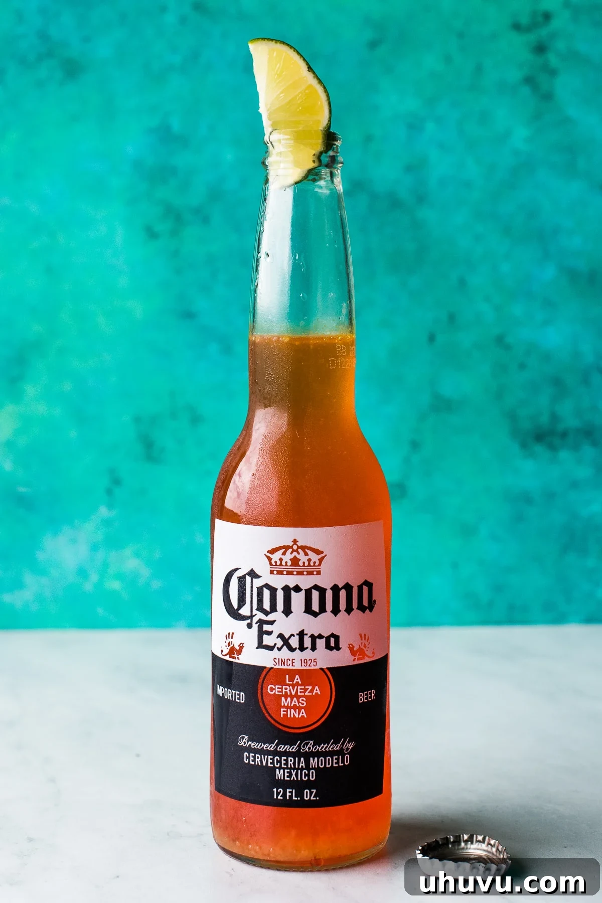 Dawn of the Crown 5 Corona Sunrise (TikTok drink) with a lime wedge.