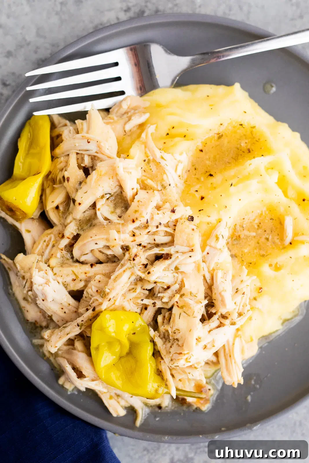 Authentic Mississippi Slow Cooker Chicken 2 Slow Cooker Mississippi Chicken served over mashed potatoes