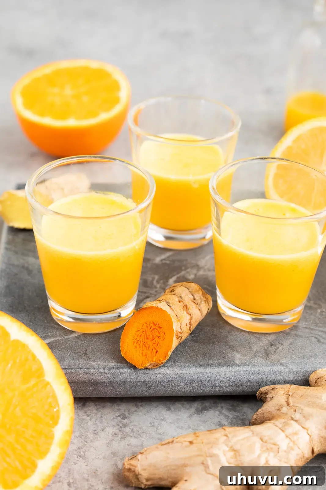 Ginger Turmeric Citrus Juice Shots in glass shots