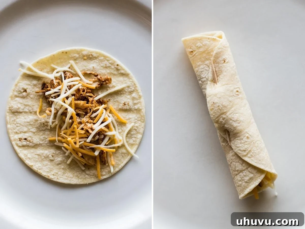 A warm corn tortilla topped with shredded chicken and shredded cheese. Ready for rolling.