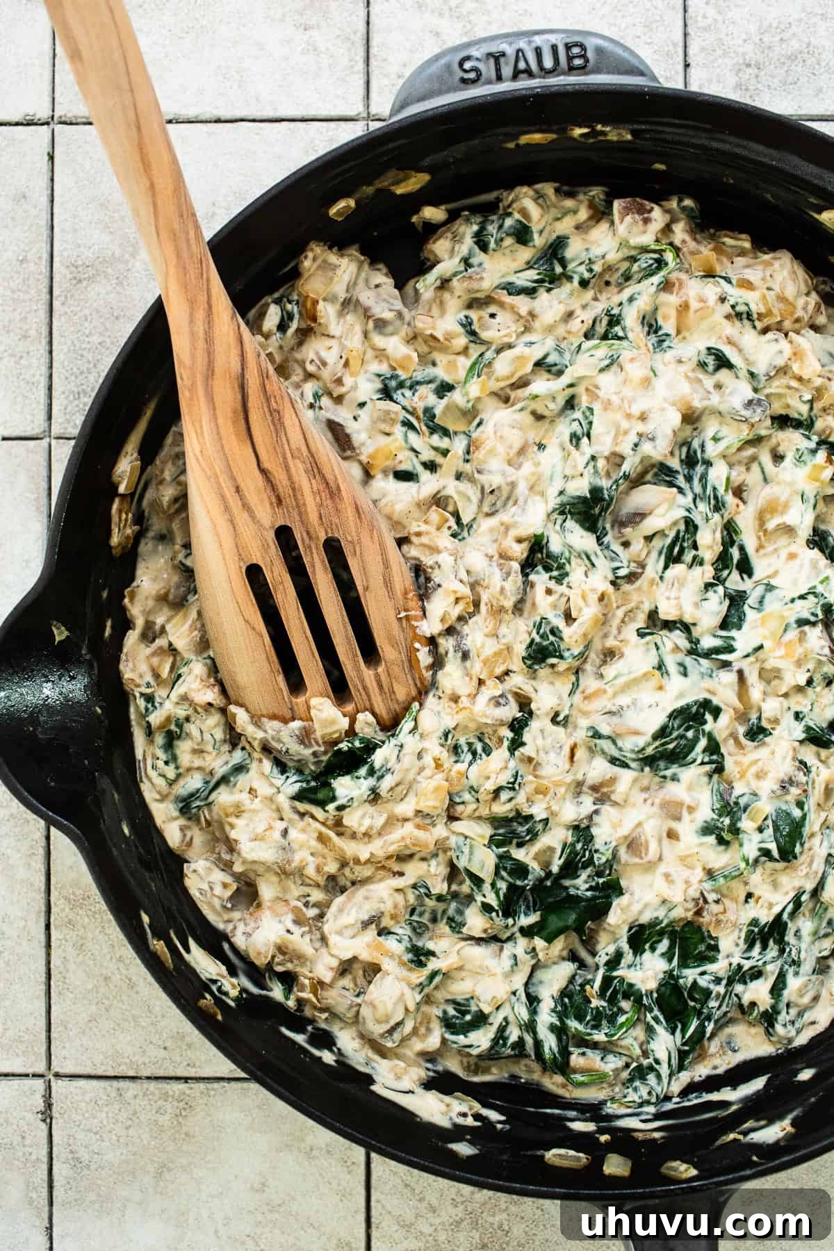 Creamy Spinach Enchiladas 4 A skillet filled with sautéed mushrooms, onions, garlic, and wilted spinach, seasoned to perfection for the enchilada filling.