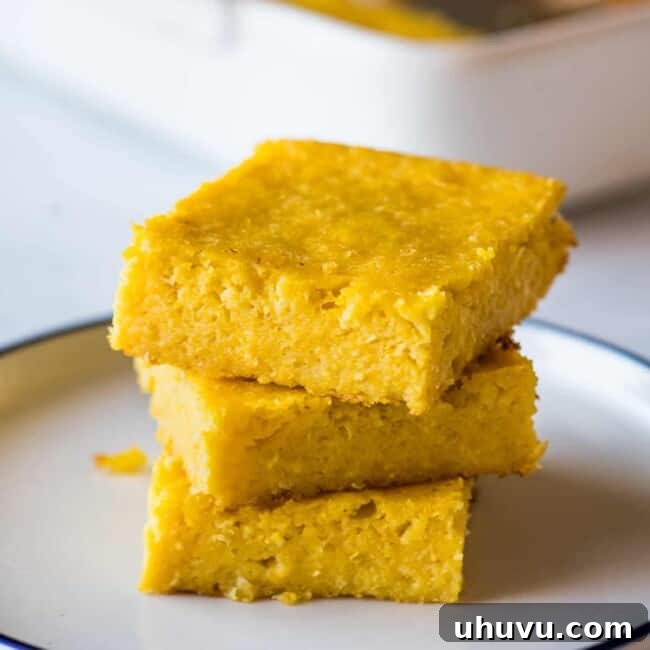 Pan de Elote stacked on top of one another on a plate.