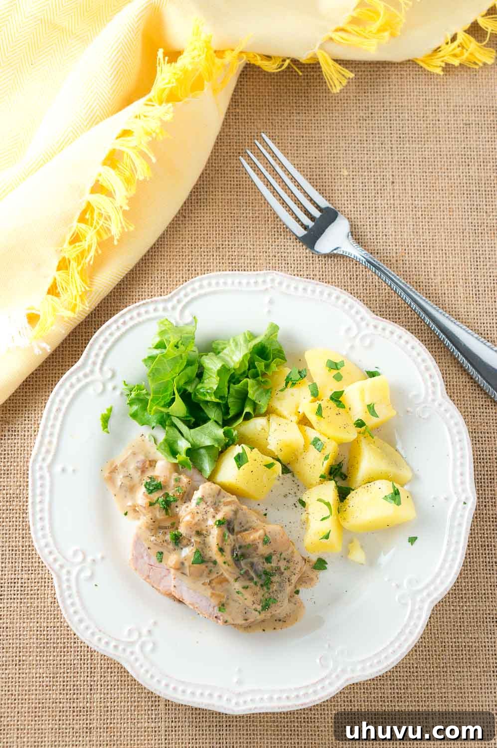 Plated pork medallions with creamy mushroom Marsala sauce, ready to be enjoyed.