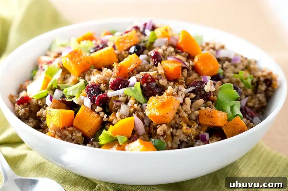 A wide shot of the Harvest Butternut Squash Quinoa Salad on a rustic wooden table, perfect for gatherings.