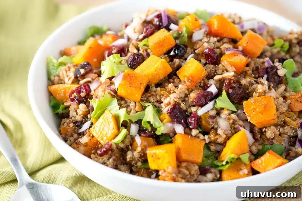 A serving of Harvest Butternut Squash Quinoa Salad on a white plate.