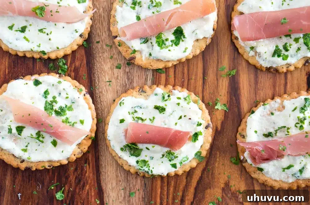 Platter of Ricotta and Prosciutto Cracker Appetizers with a bowl of spread