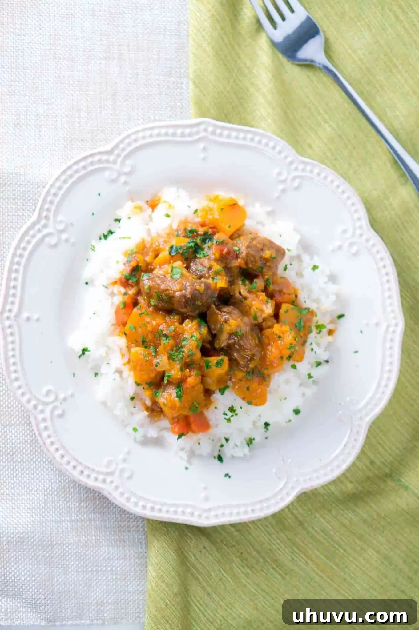 Instant Pot Beef and Butternut Squash Stew served over rice