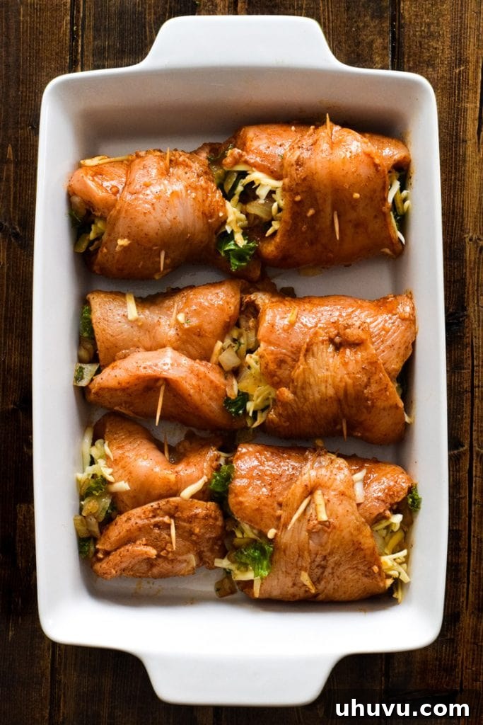 Creamy Chicken Pinwheels 3 Two chicken enchilada roll ups with melted cheese and red sauce