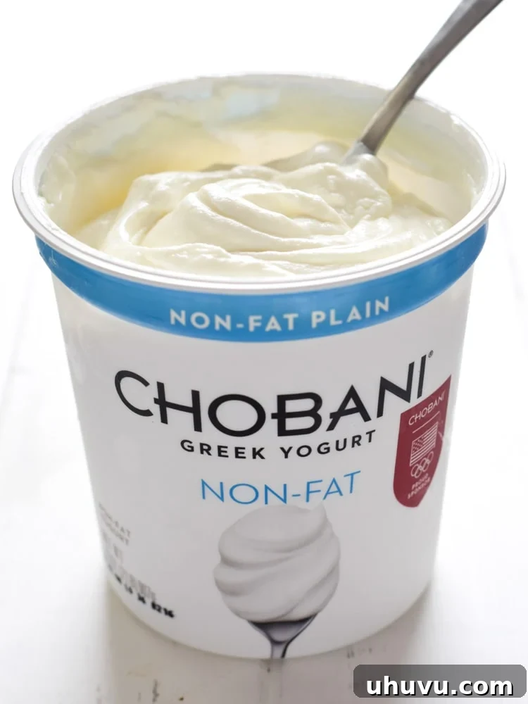 Creamy Chobani plain Greek yogurt blended with vibrant salsa verde and fresh cilantro creates an irresistibly tangy and smooth sauce, enhancing the frittata with its refreshing flavor.