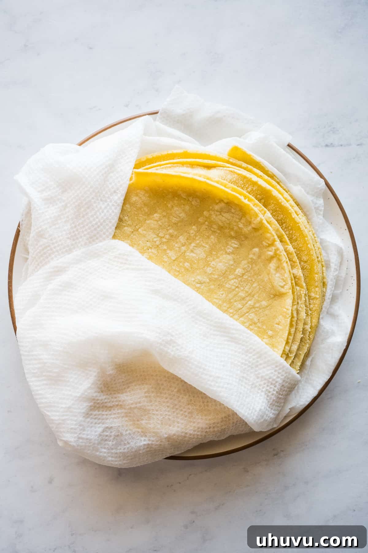 Crispy Rolled Tacos 8 Corn tortillas wrapped in a damp paper towel to keep them moist when being warmed in the microwave.
