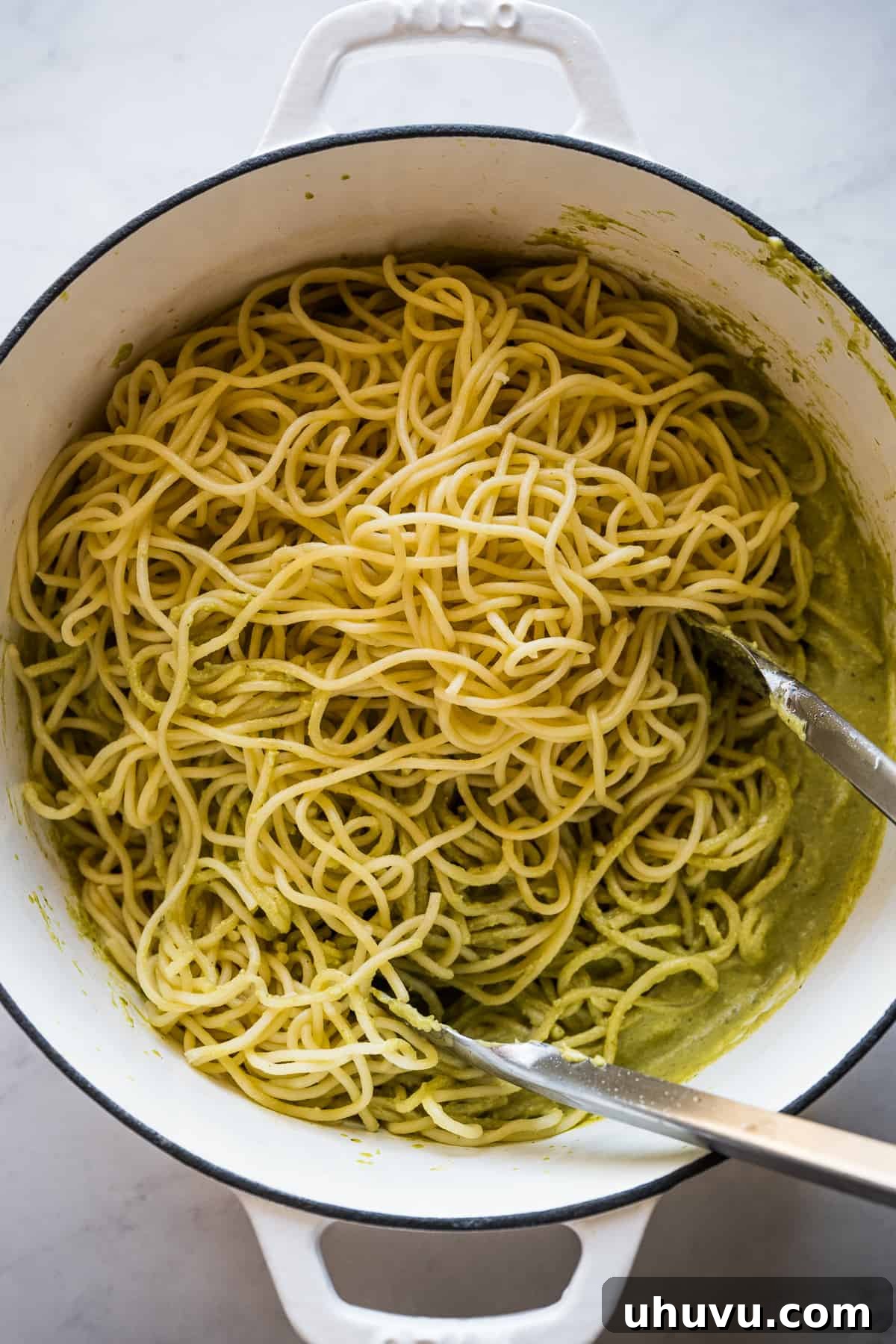 Zesty Green Spaghetti 11 A close-up of the finished Green Spaghetti (Espagueti Verde) in the pot, perfectly coated in the vibrant green sauce.