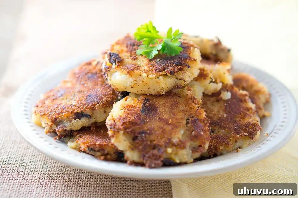 Crispy Leftover Mashed Potato & Bacon Patties, served with greens and avocado slices