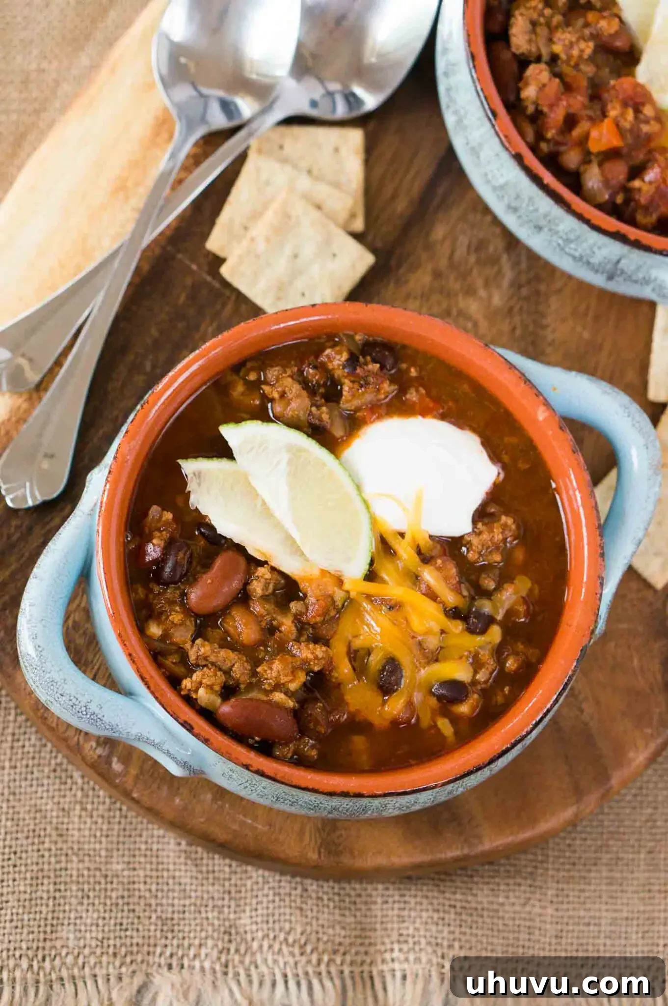 Hearty Instant Pot Chili 2 close up image of instant pot chili in a bowl with toppings
