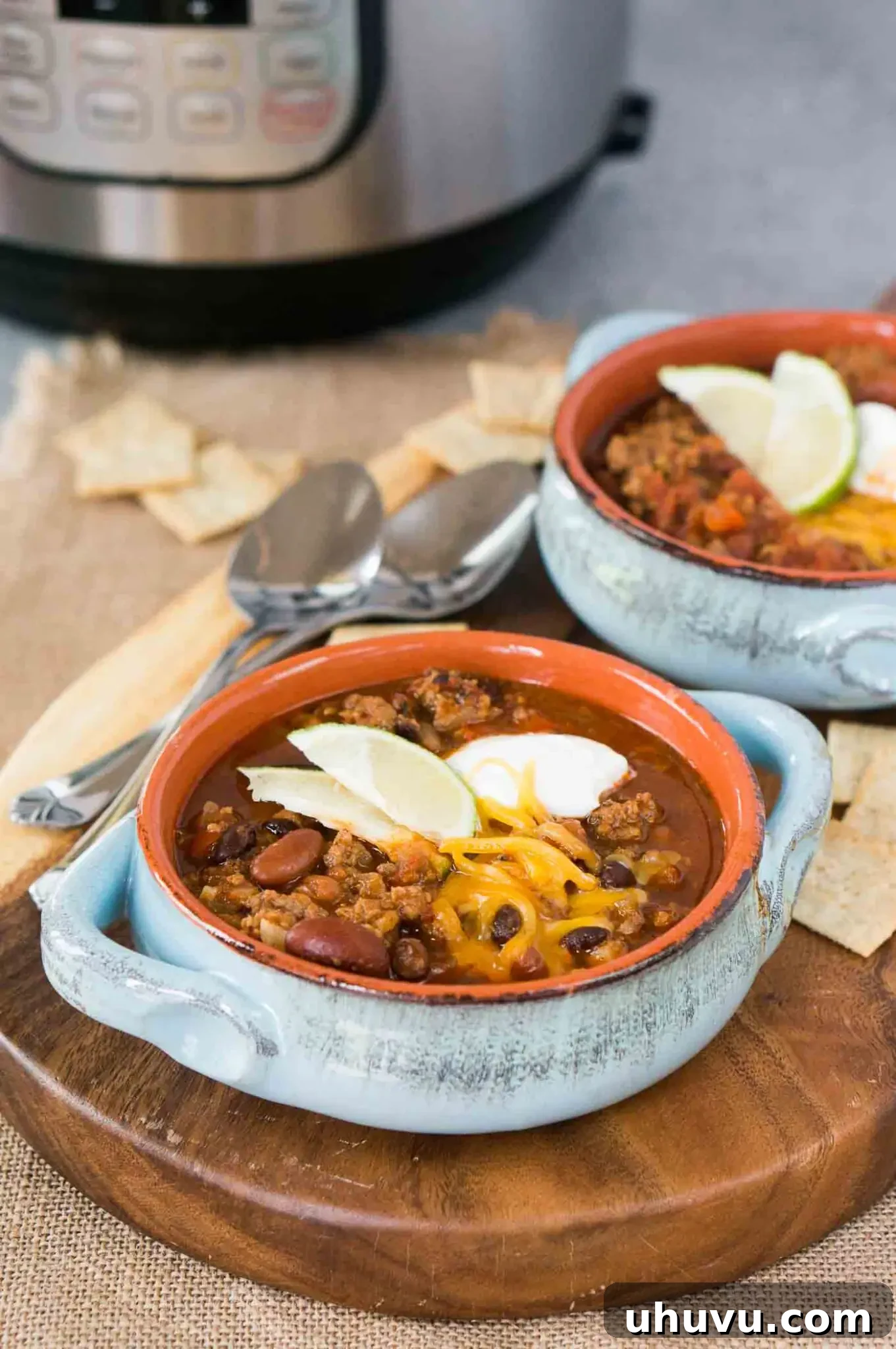 Hearty Instant Pot Chili 7 chili in bowls with pressure cooker in background