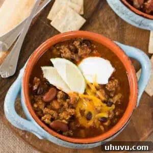 Hearty Instant Pot Chili 9 close up image of instant pot chili in a bowl with toppings