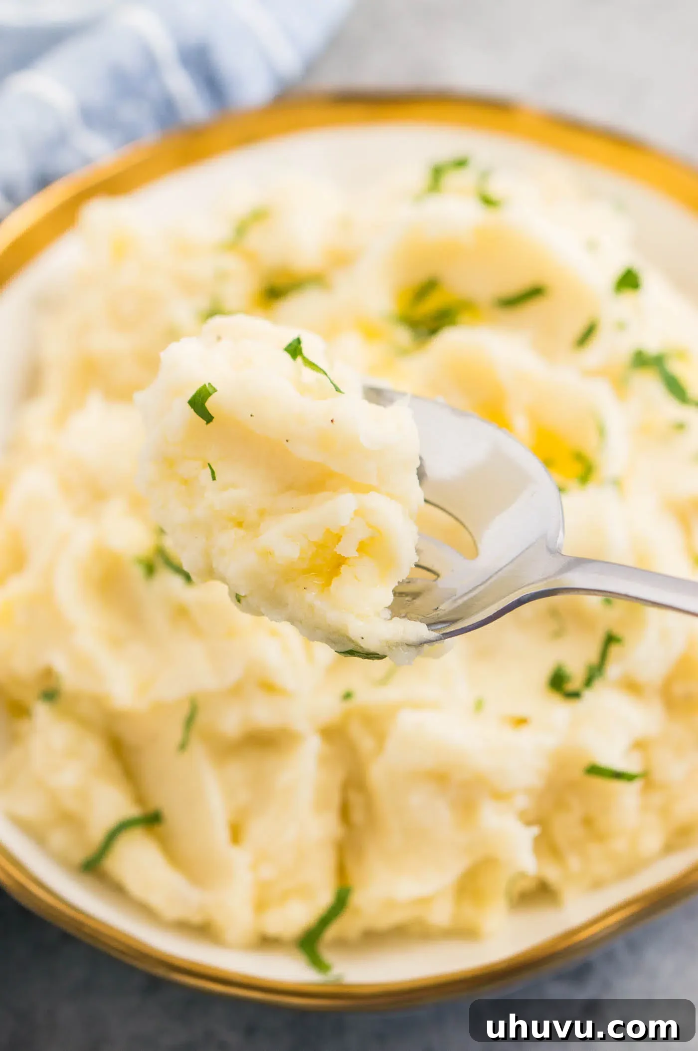a scoop of creamy potatoes on a serving spoon