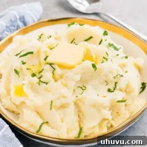 mashed potatoes with slice of butter in a bowl