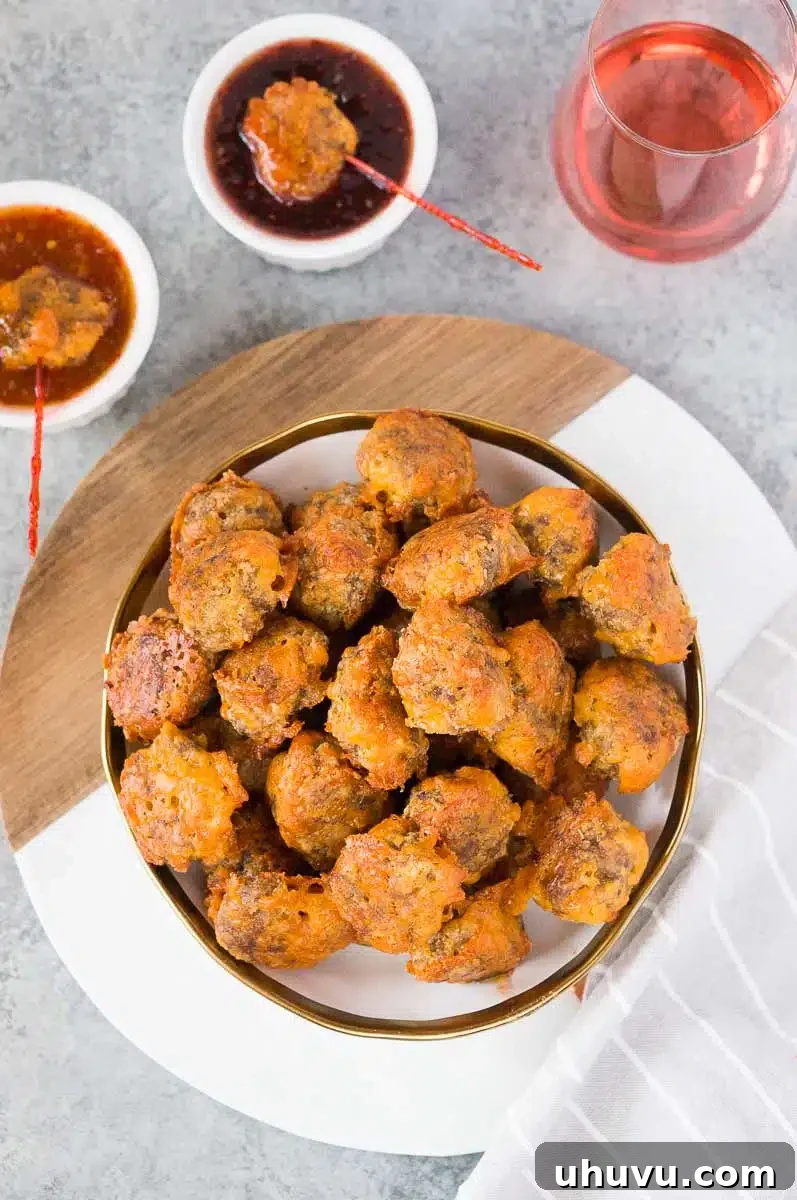 Easy gluten-free sausage balls served as an appetizer with a selection of dips
