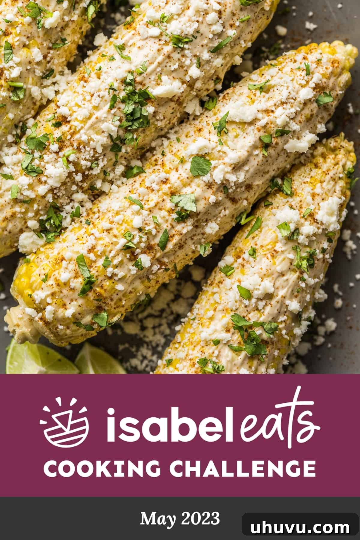 May Flavors Cook-Off 2 A vibrant, close-up shot of Mexican Street Corn (Elotes) on a cob, generously topped with creamy sauce, crumbled cheese, and a sprinkle of chili powder. It looks incredibly appetizing and ready to be enjoyed as a summer treat.