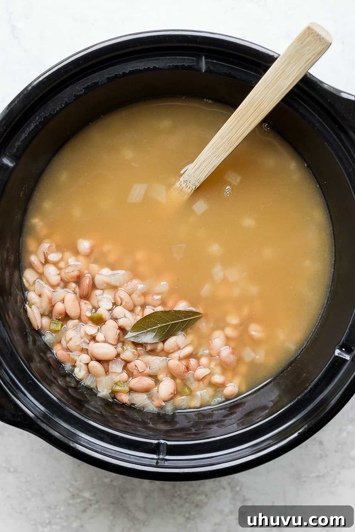 Easy Slow Cooker Pinto Beans 7 Cooked crock pot pinto beans ready to serve.