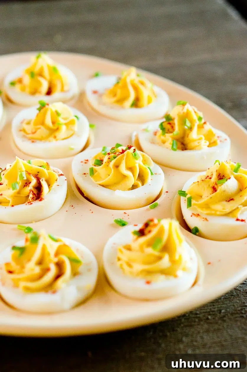 Egg appetizer on a plate garnished with fresh herbs