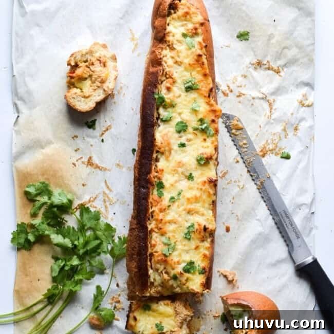 A crowd favorite, this Chicken Fajita Stuffed French Bread is a creamy, cheesy, and super flavorful appetizer that's perfect for parties and game day!