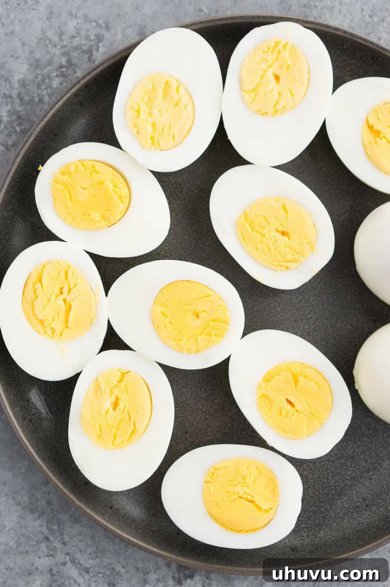 close up image of cut hard boiled eggs on a plate
