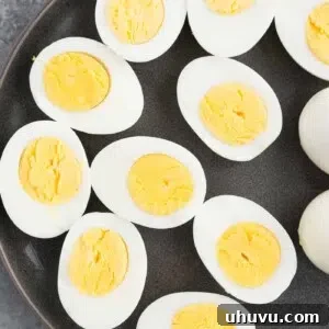 Foolproof Instant Pot Hard Boiled Eggs 6 close up image of cut hard boiled eggs on a plate
