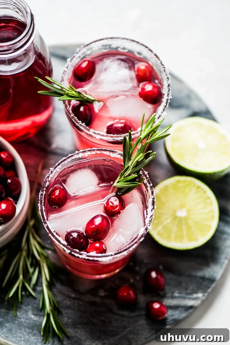 Effortless Cranberry Margarita 5 A beautifully garnished Cranberry Margarita, the perfect Christmas drink, simple to make with only 4 ingredients.