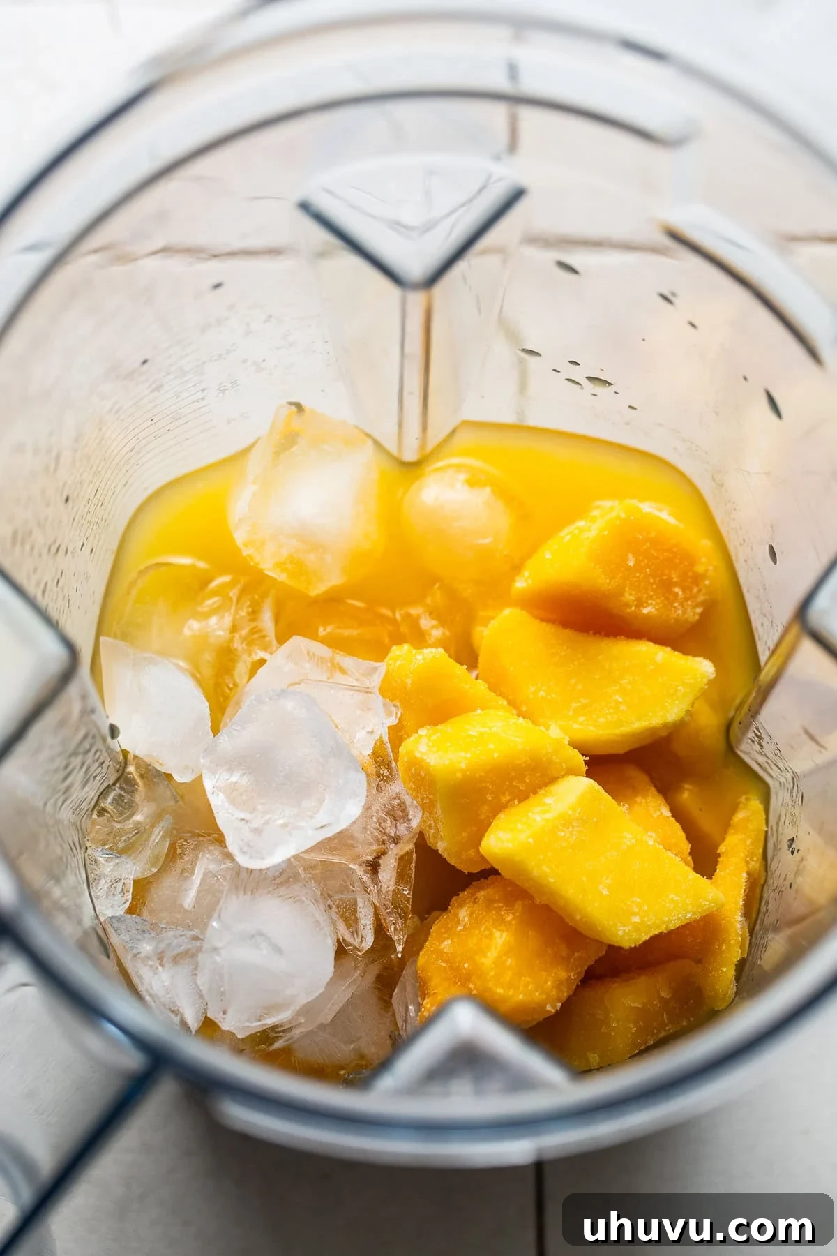 Mango Chili Thrill 4 A blender filled with all of the mangonada ingredients.