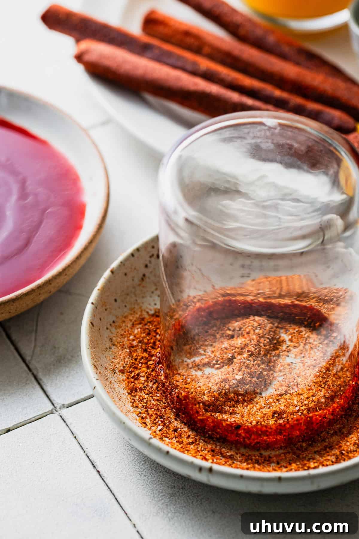 Mango Chili Thrill 6 Dip the glasses rim in some chamoy, then fill a bowl with chili lime seasoning, and coat the edges of the cup.