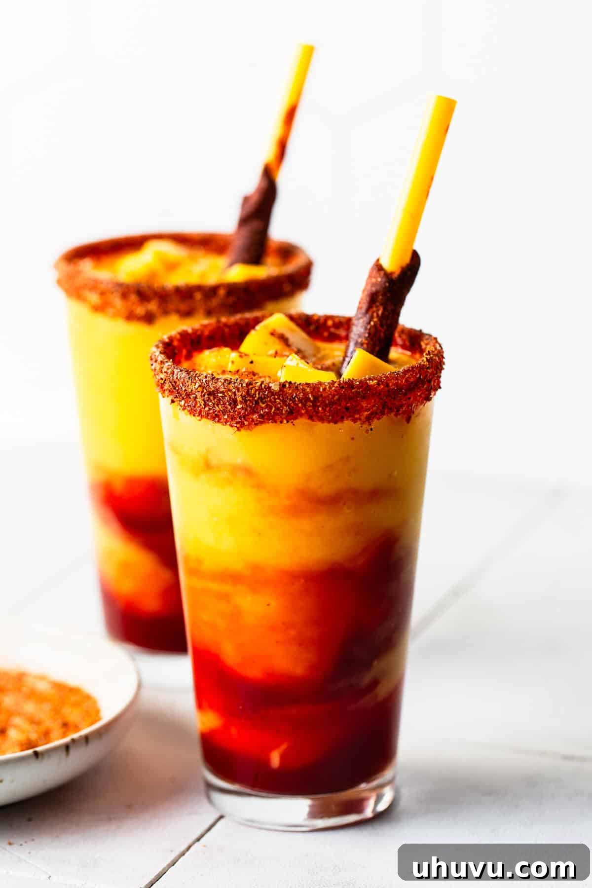 Mango Chili Thrill 7 In a tall glass pour the mangonada mixture and add a tamarind candy straw.
