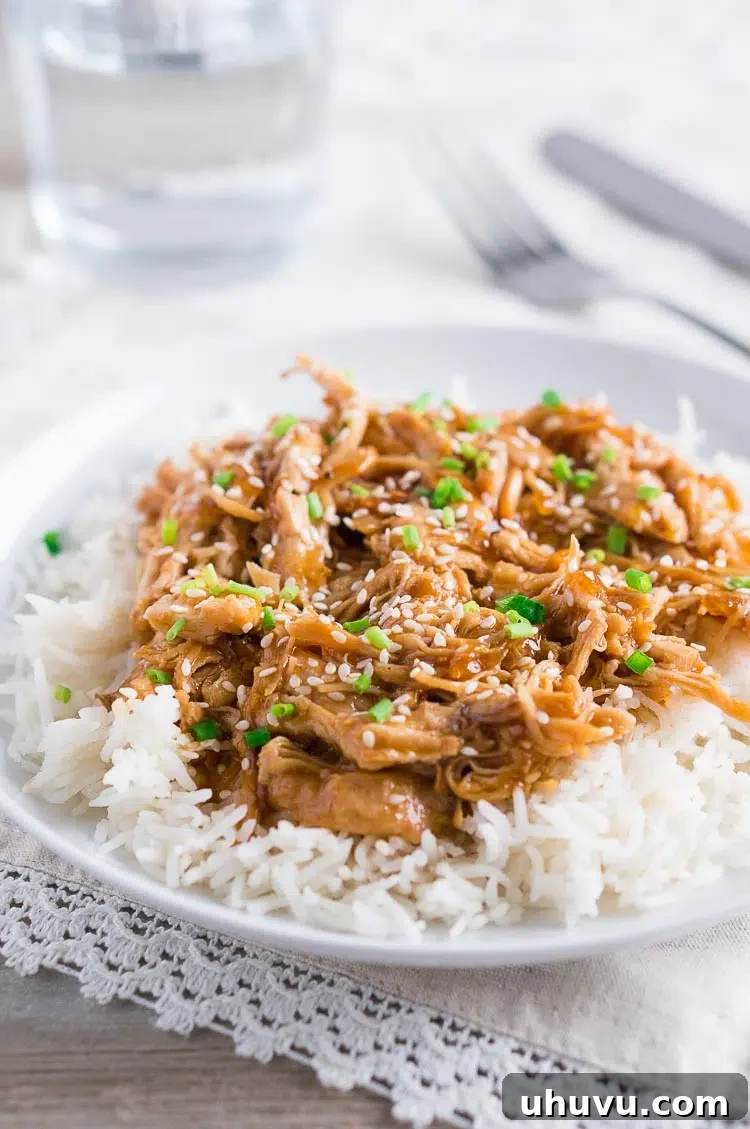 Sweet and Sticky Instant Pot Honey Sesame Chicken 4 Instant Pot Honey Sesame Chicken in a bowl with a fork