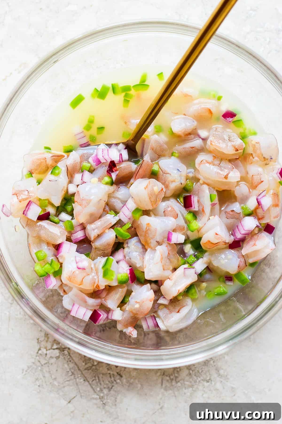 Ceviche The Zesty Seafood Sensation 6 Ingredients for ceviche mixed together in a bowl.