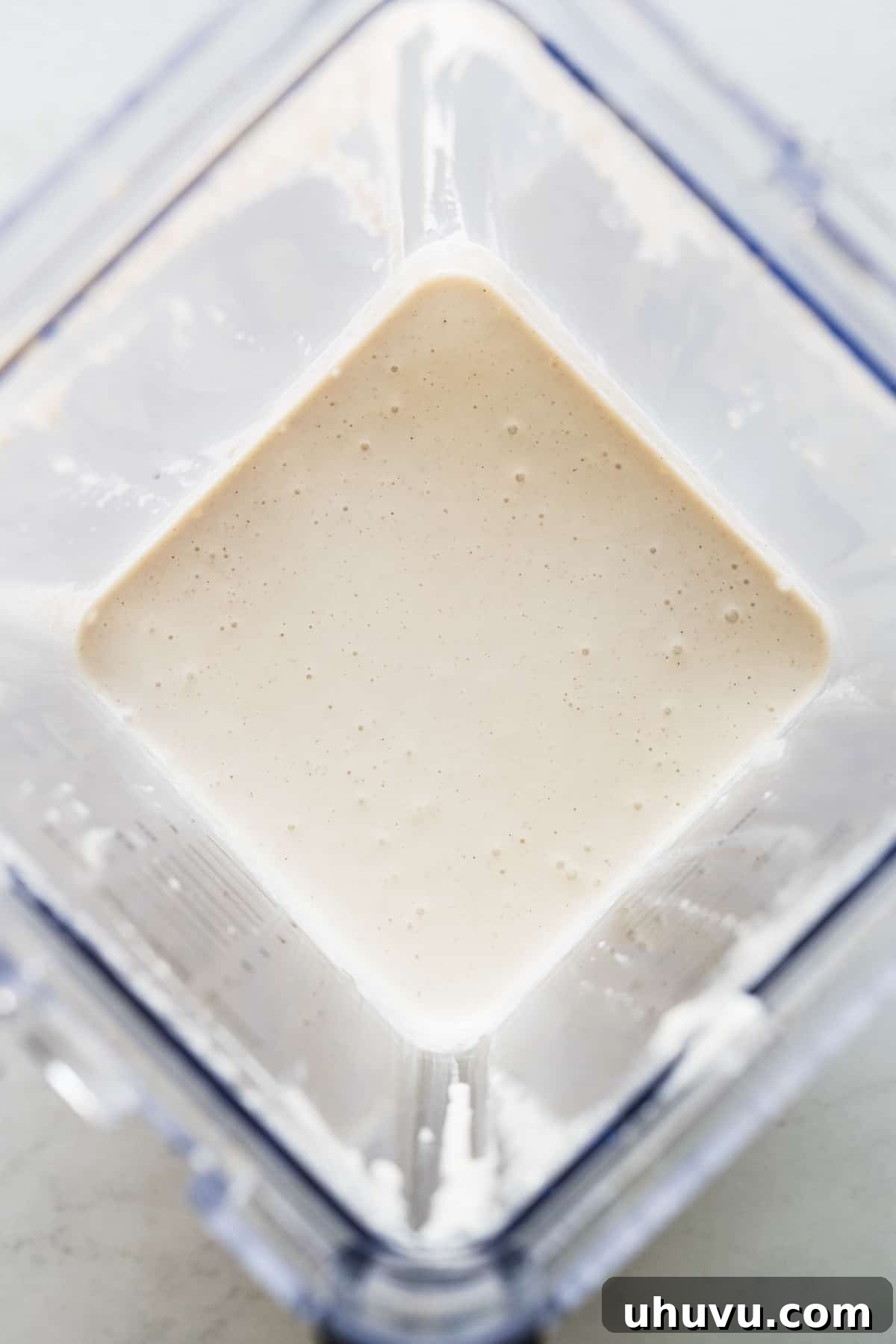 The walnut sauce for chiles en nogada in a blender.