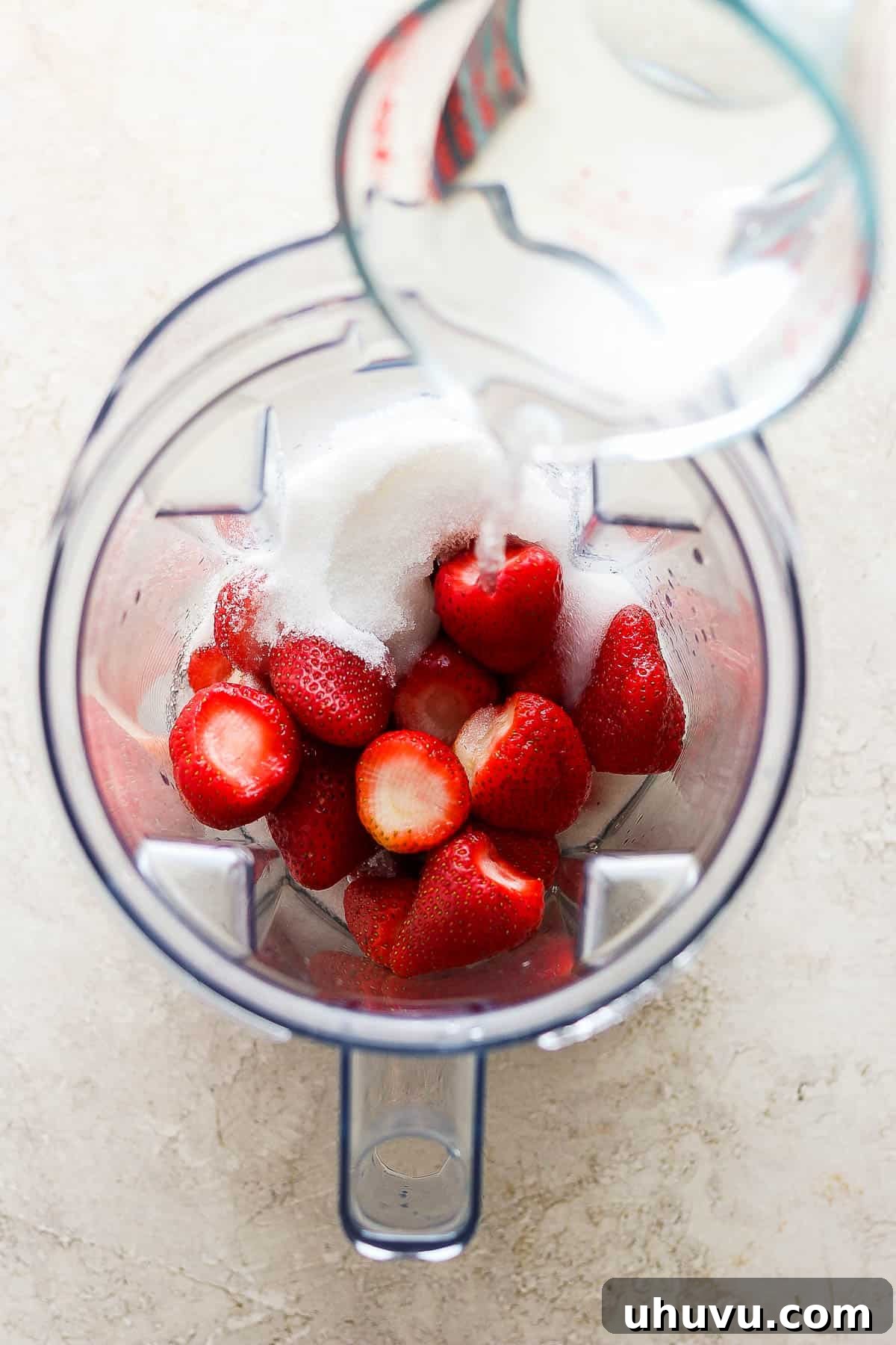 Refreshing Strawberry Sip 4 Strawberries, sugar, and water in a blender.