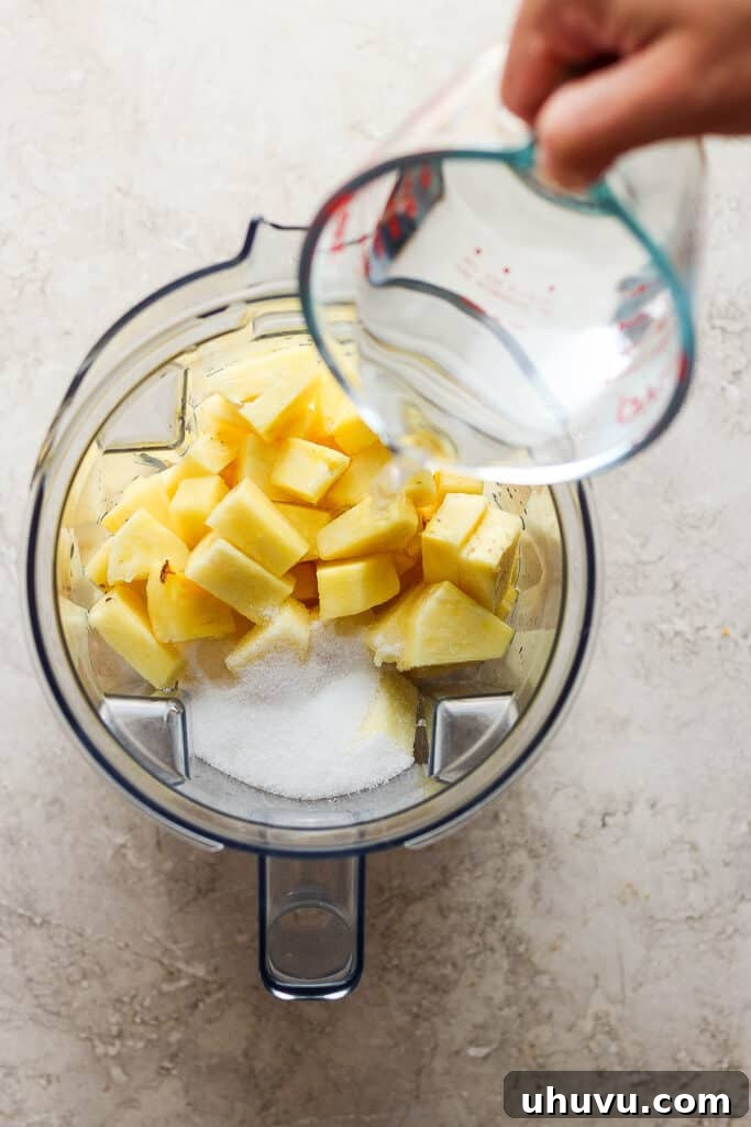 Tropical Pineapple Quencher 4 Pineapple, water, and sugar in a blender.