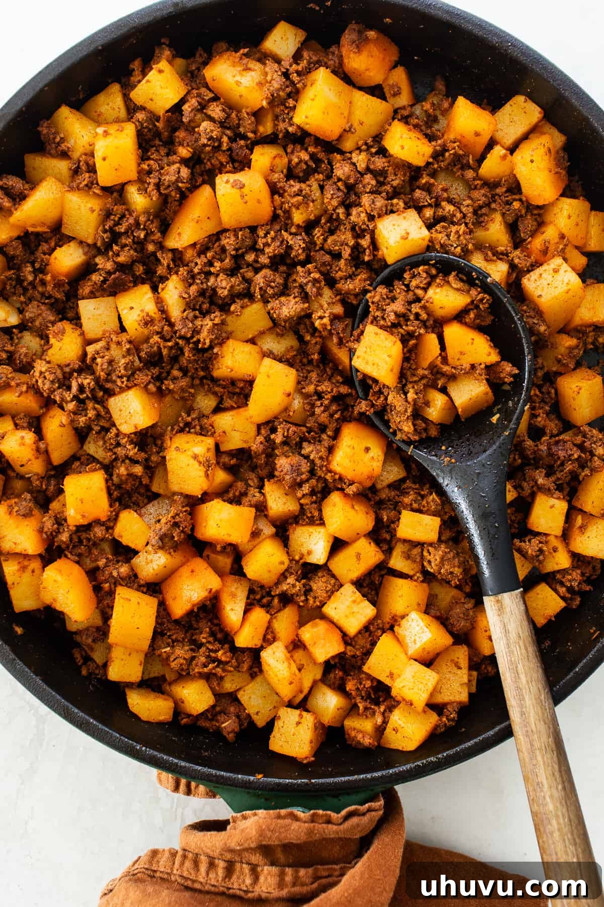 The chorizo and potato mixture for pambazos in a skillet.