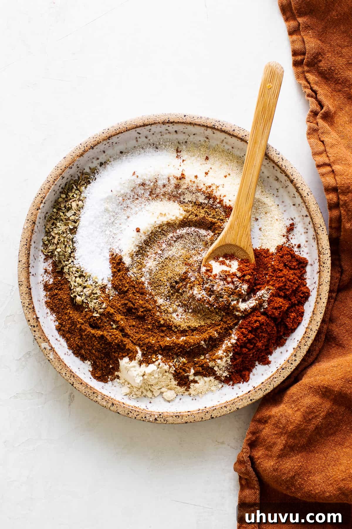 A homemade taco seasoning blend on a plate, ready to be used.