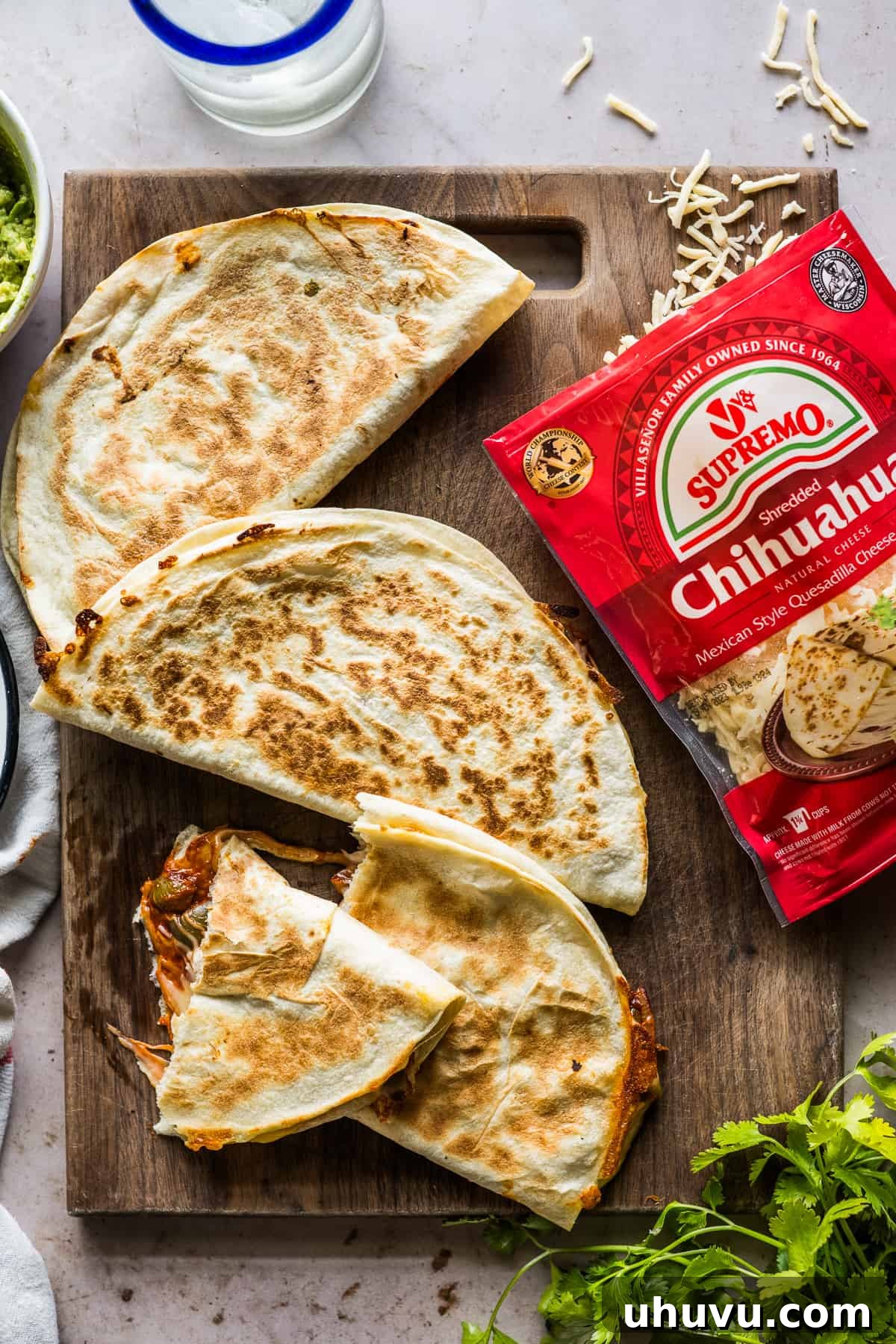 Spicy Nopal Quesadillas 13 A perfectly cooked Quesadilla de Nopales en Chile Rojo, golden brown and crispy, resting on a cutting board, ready to be enjoyed.