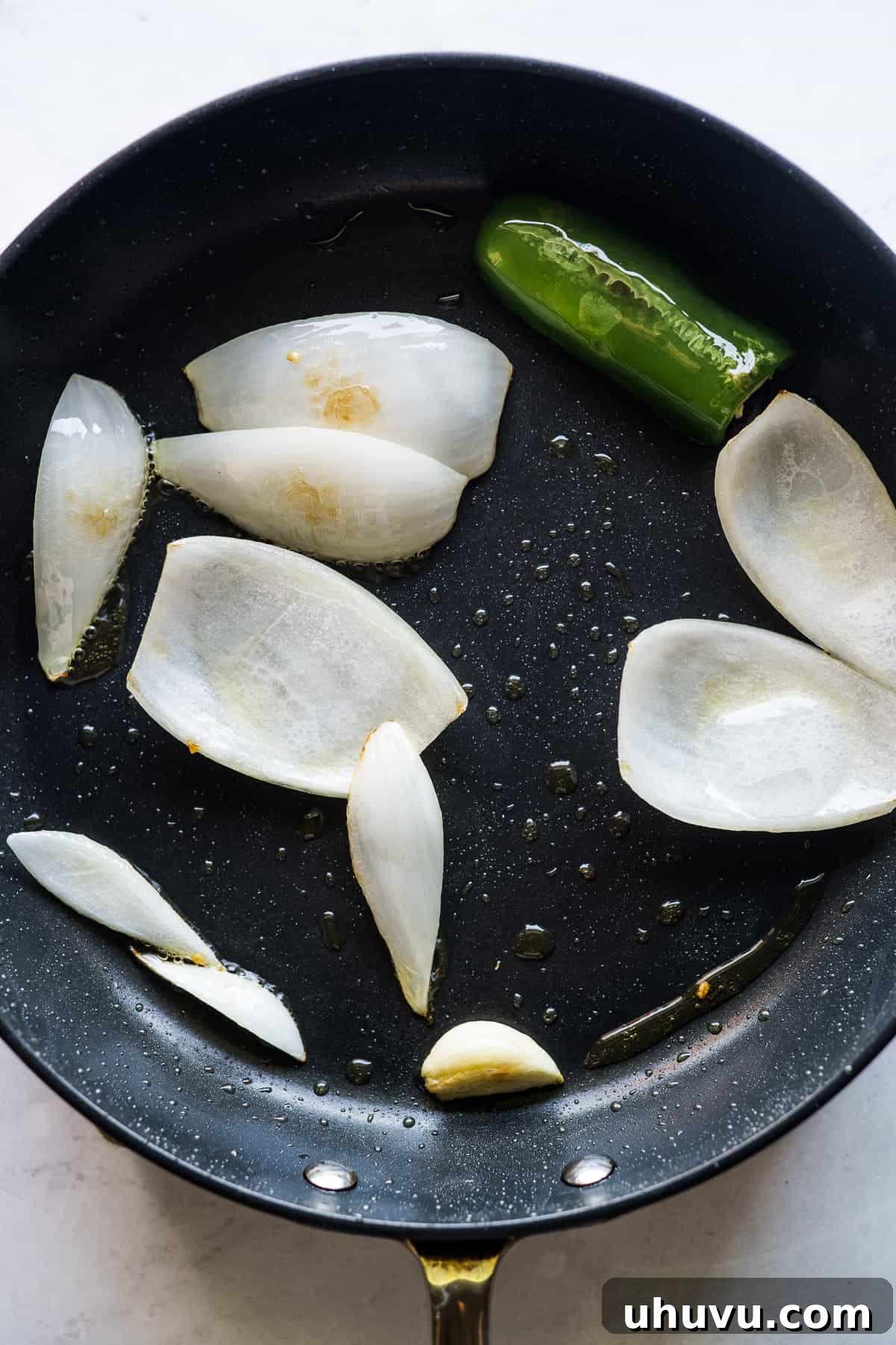 Mexican Masa Pockets 4 Onion, jalapeño, and garlic sauteing in a large skillet.