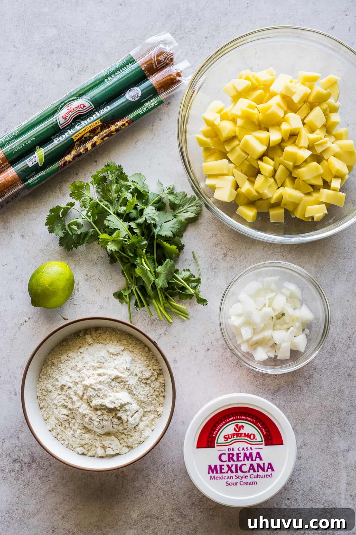 Ingredients for homemade gorditas de papas con chorizo laid out on a table.