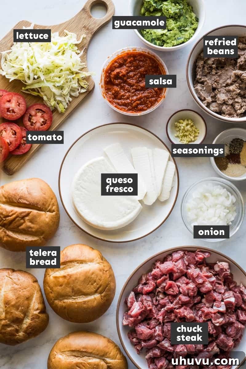 Authentic Mexican Torta 4 Various ingredients for Mexican Tortas artfully arranged on a table.