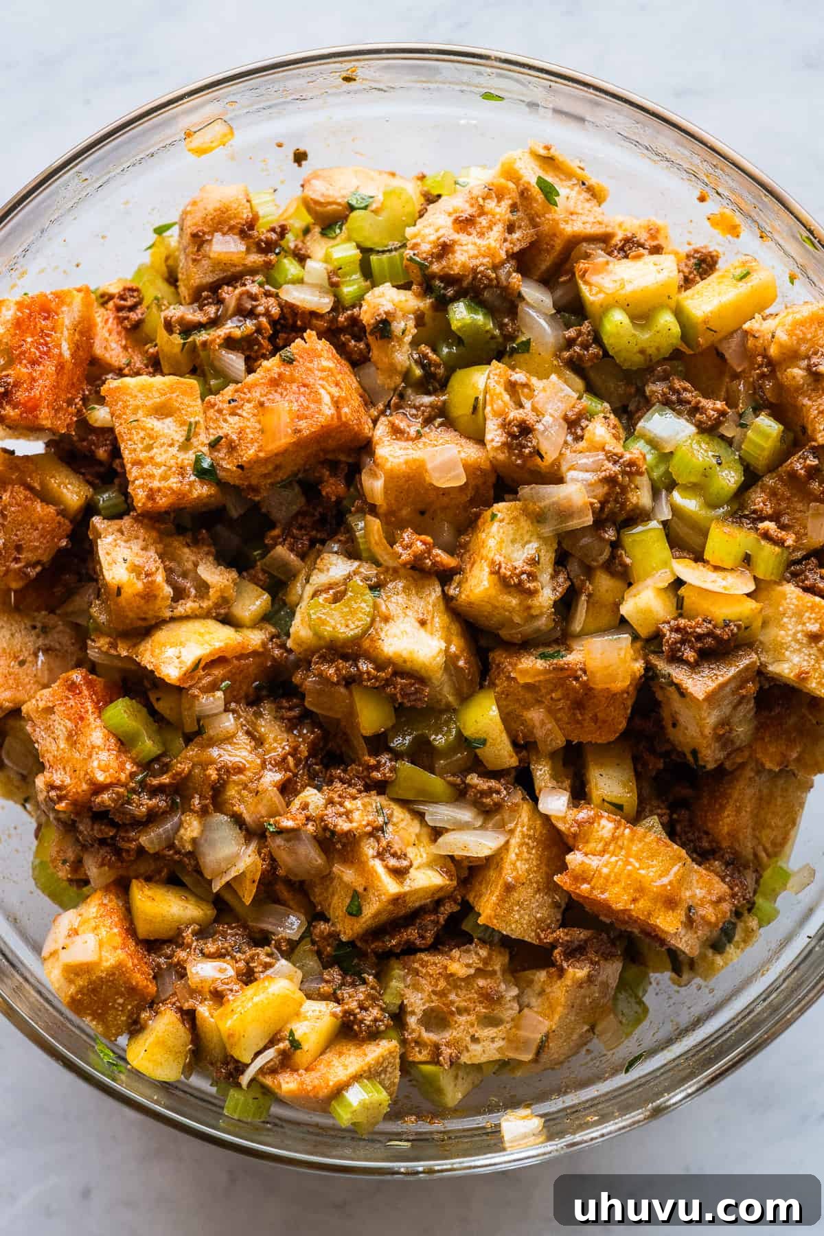 Spicy Chorizo Stuffing 8 A mixed bowl of pre-baked chorizo stuffing, showcasing all the ingredients thoroughly combined and moist, ready for baking.