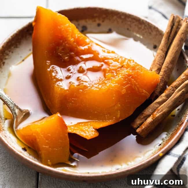 Mexican Candied Pumpkin 9 A slice of tender calabaza en tacha on a plate served with a piloncillo syrup.
